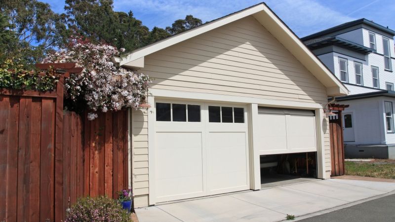 Garage door lubricant applied on a white garage door