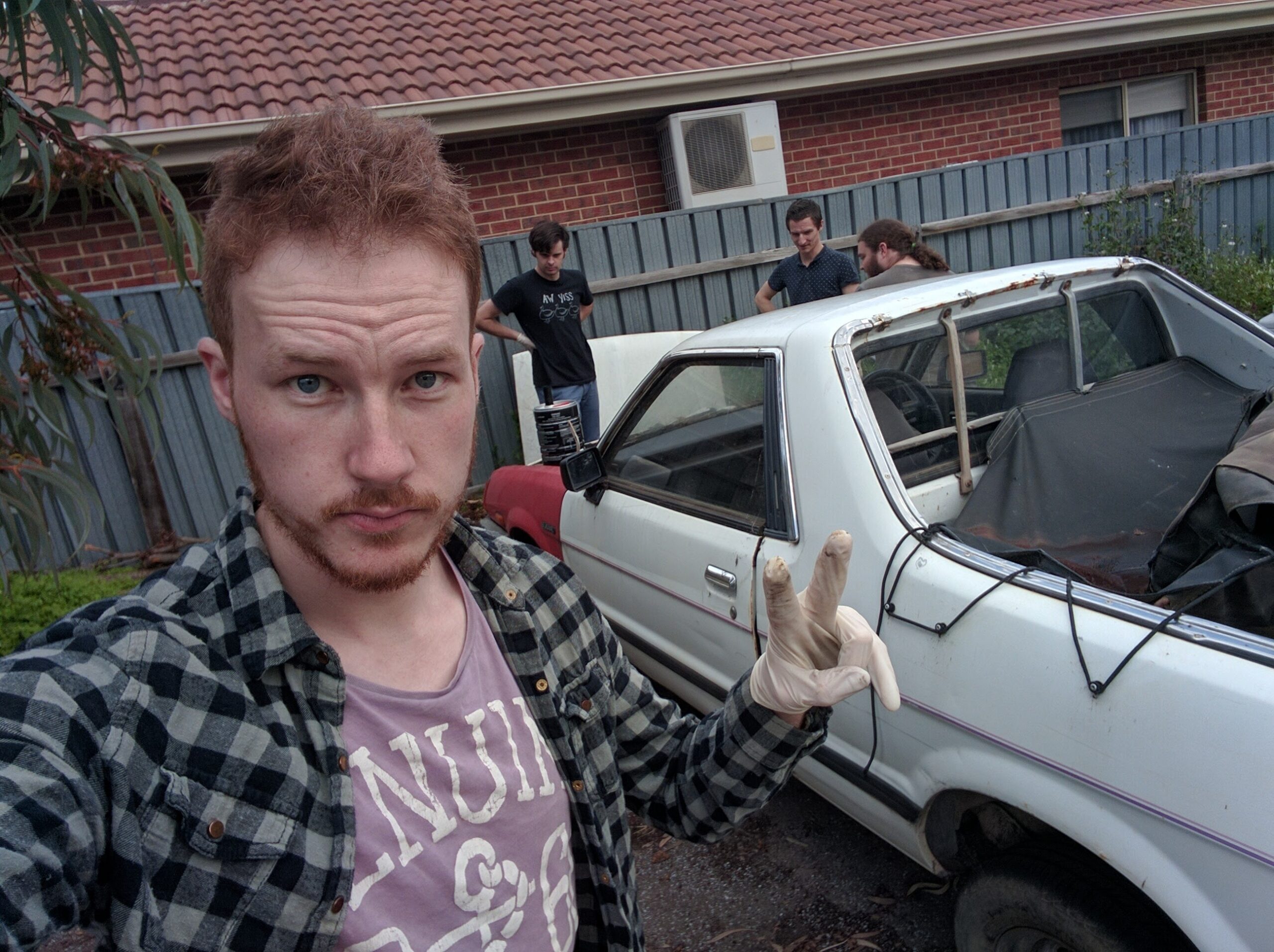 The author poses with a project car.