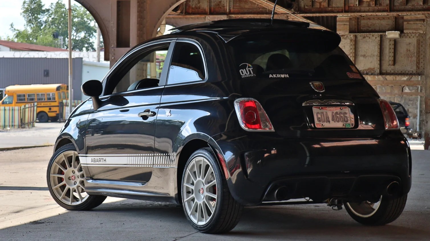 A black Fiat 500 Abarth hatchback.