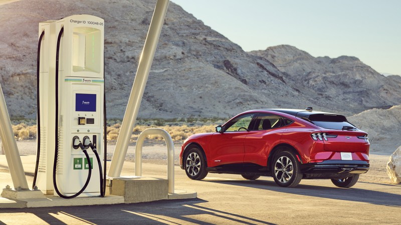 A Ford Mustang Mach-E parked at an Electrify America public charging station.