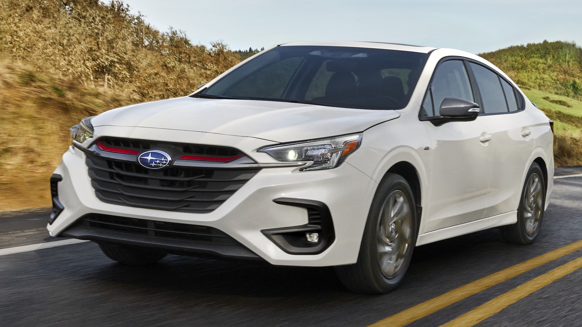 2023 Subaru Legacy in white, with a red band across the grille