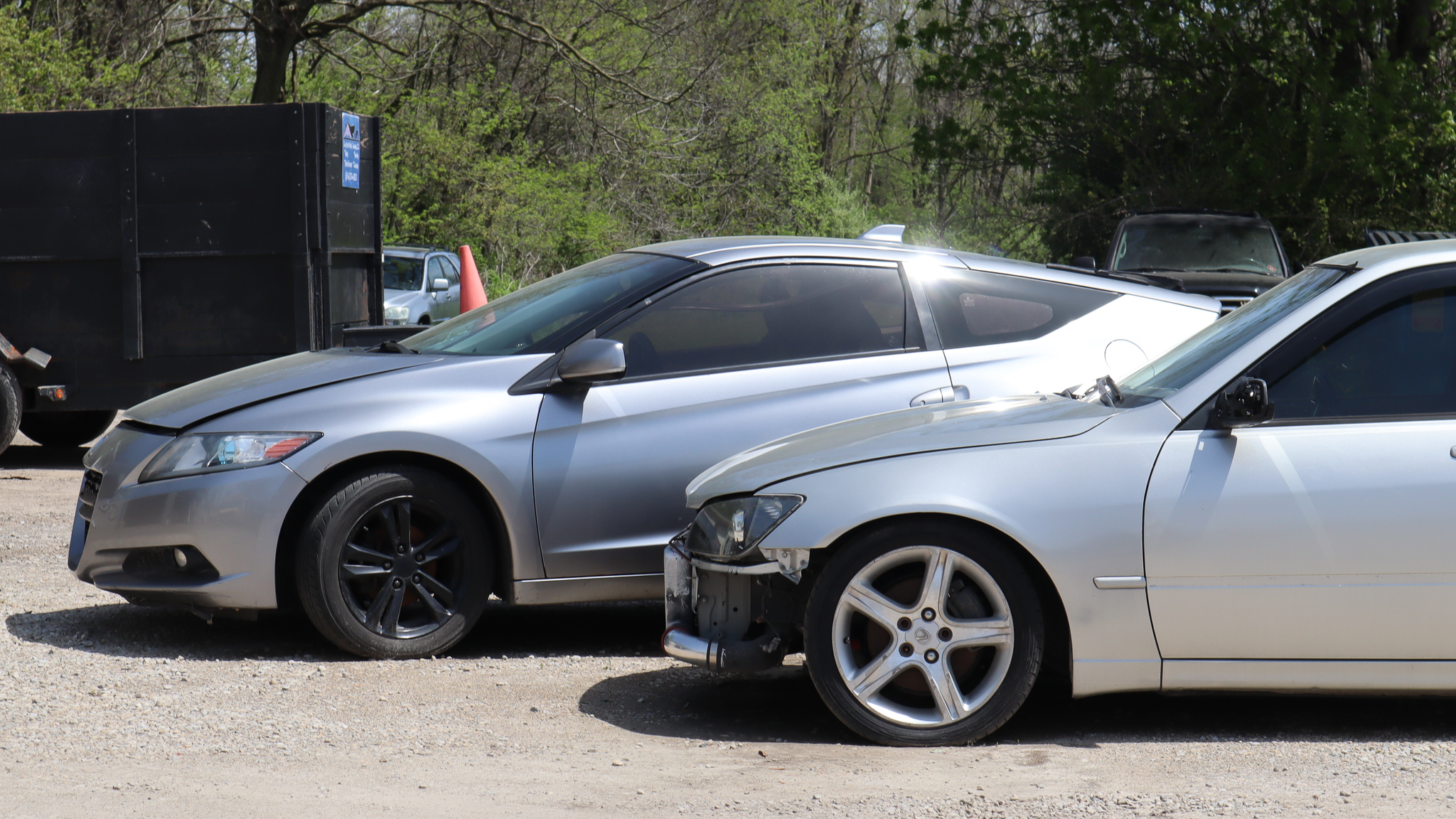 Honda CRZ With hood open next toLexus IS300 with missing bumper