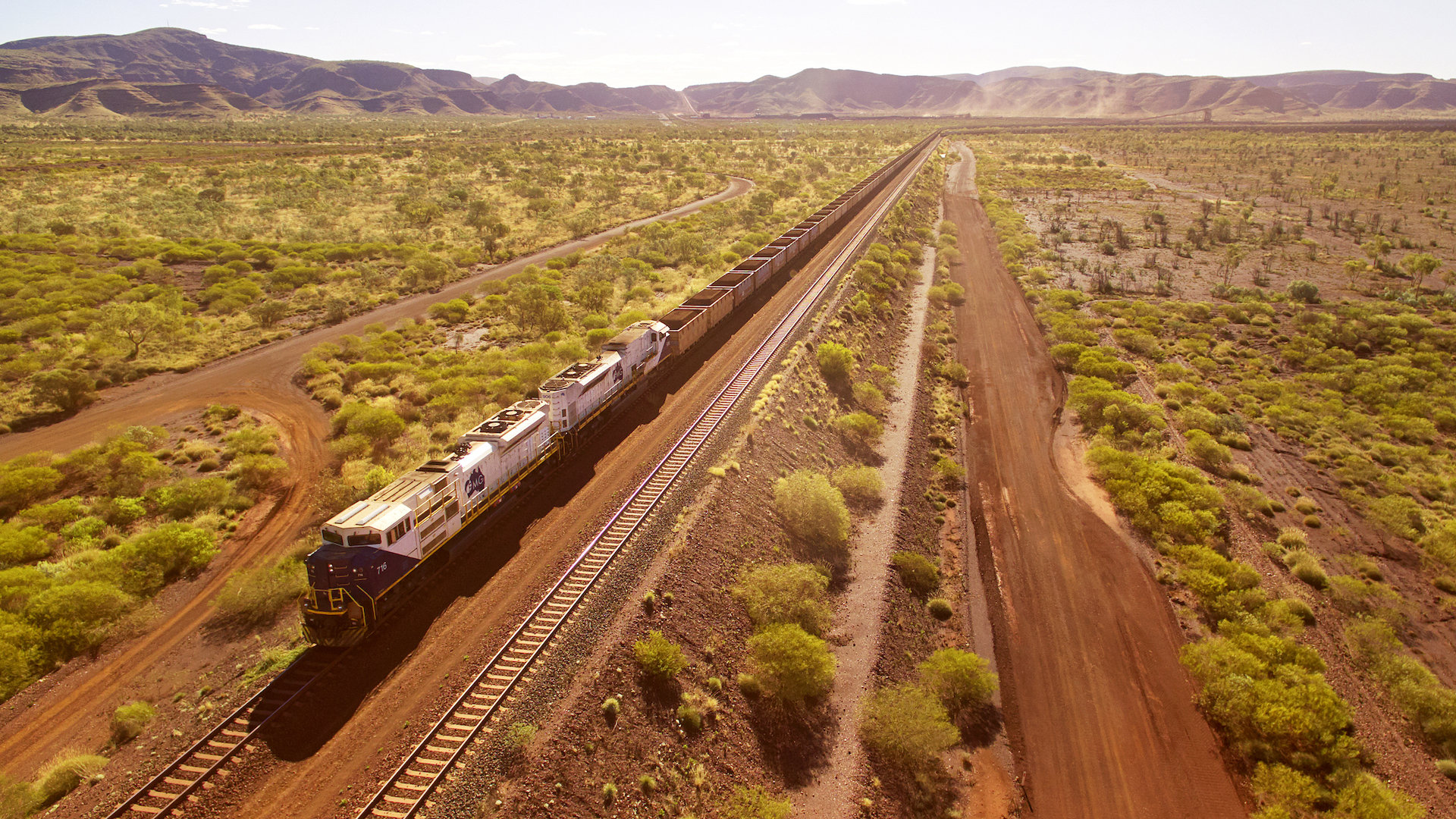 A Fortescue mining train traverses the Australian outback, as seen from above