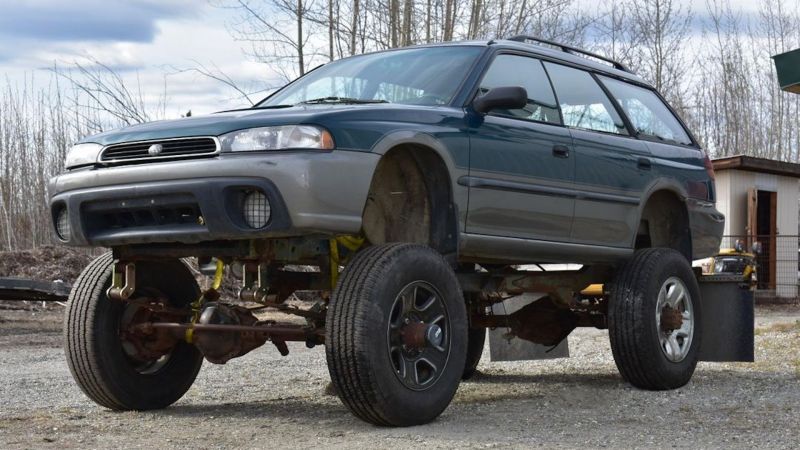 Solid-axle Subaru Outback on an extended Jeep frame