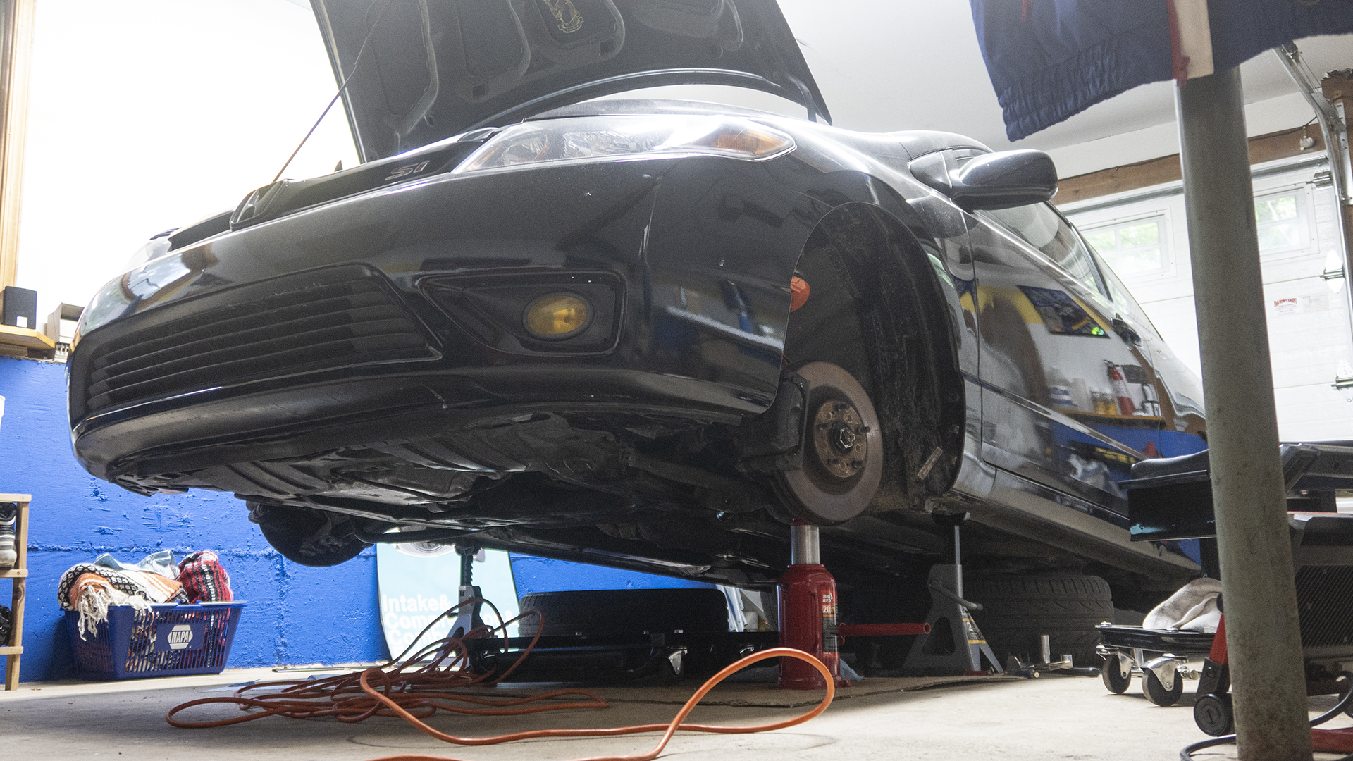 A Honda resting on jack stands.