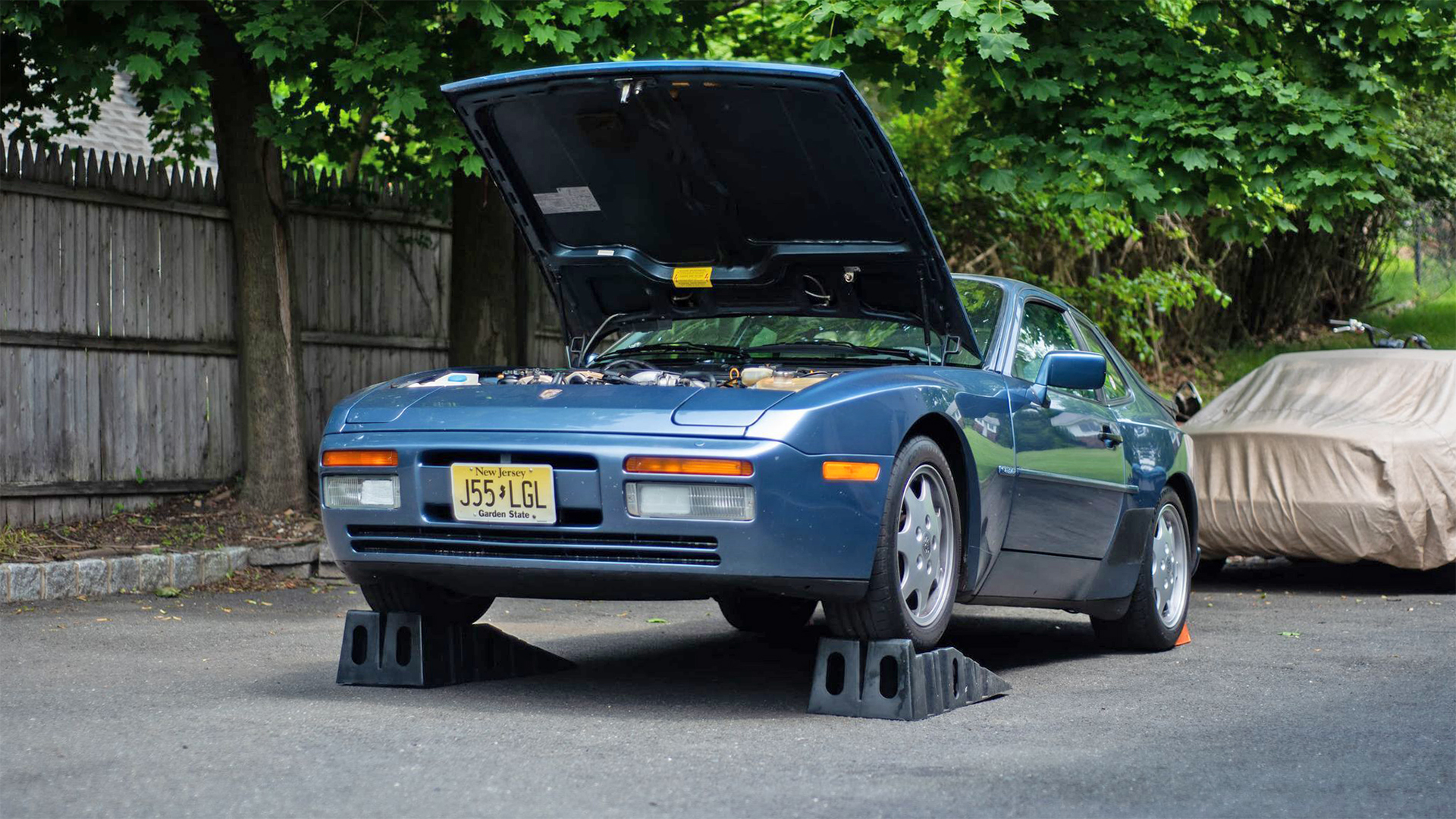 Porsche on service ramps.