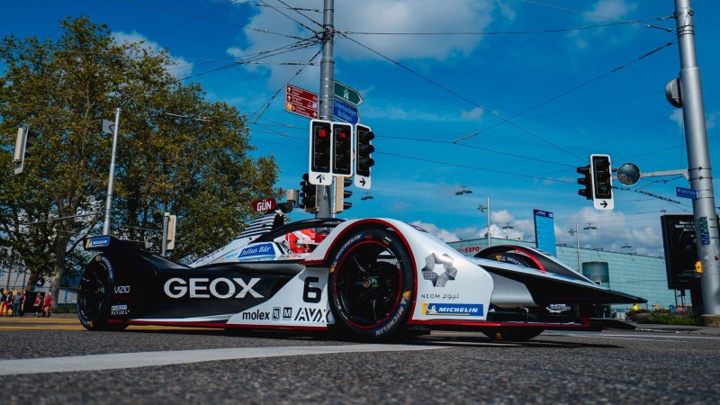 A Dragon Formula E car crossing a junction on a road in Bern, Switzerland