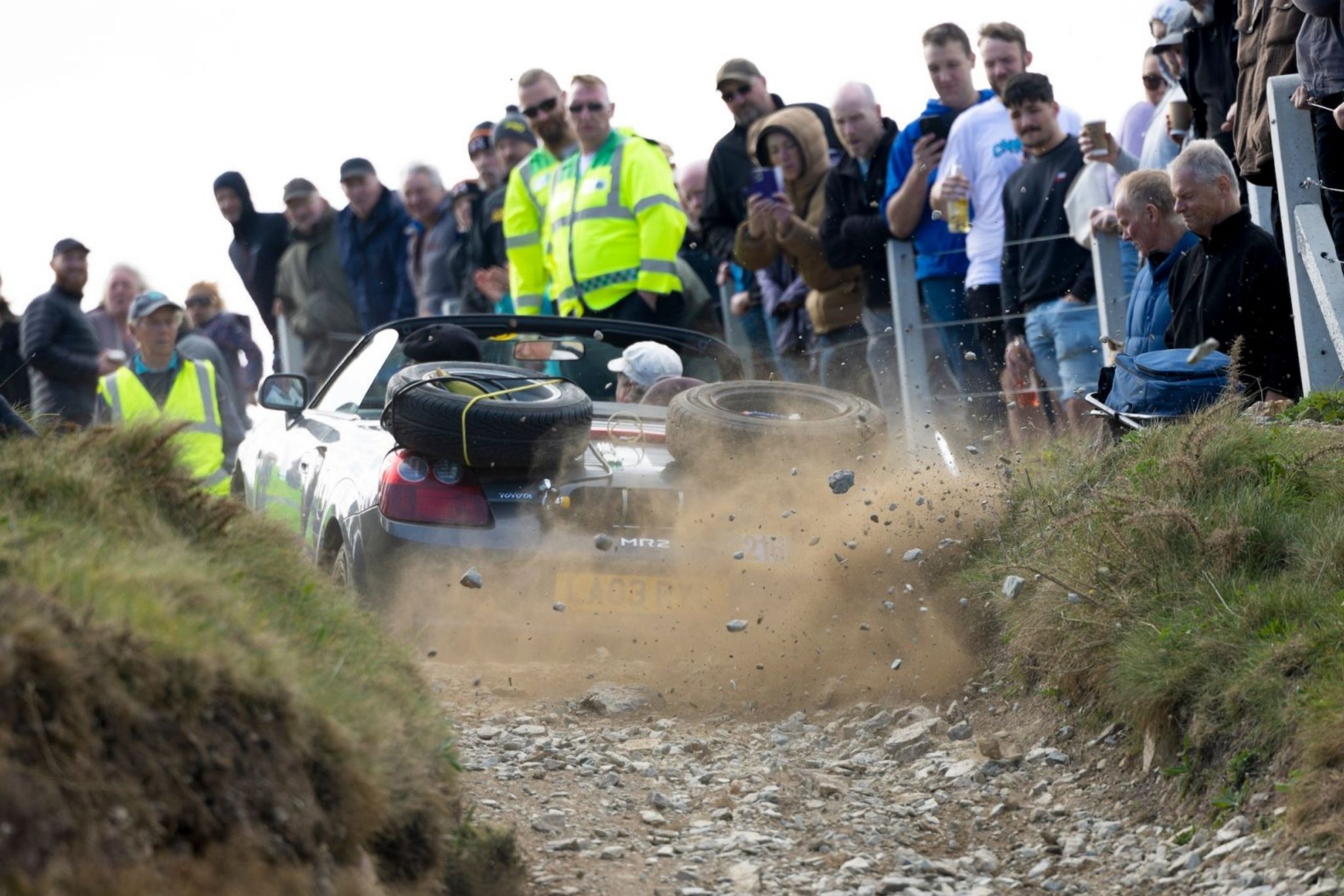 Rear end of car in a crowd up a hill