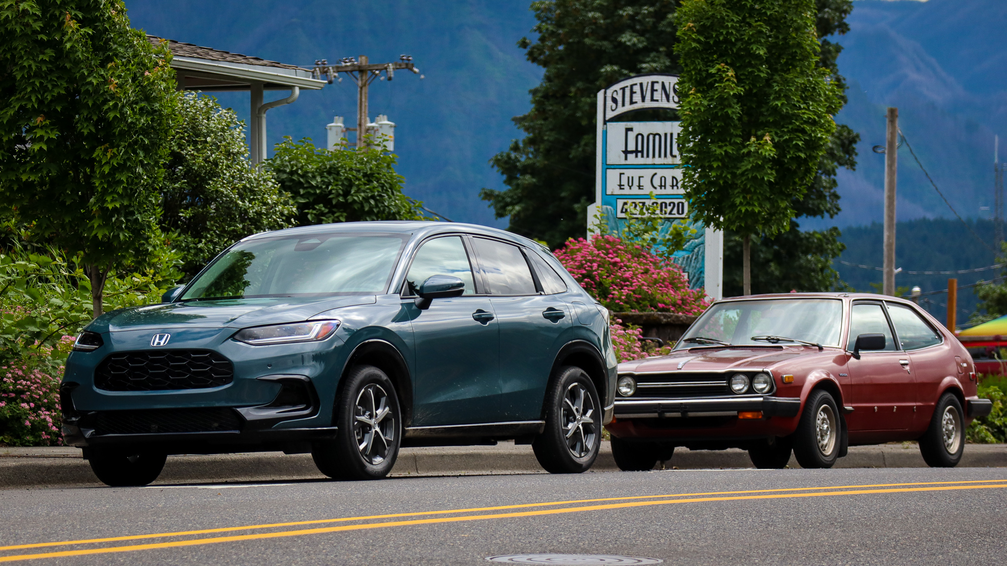 2023 Honda HR-V parked in front of 1979 Honda Accord hatchback