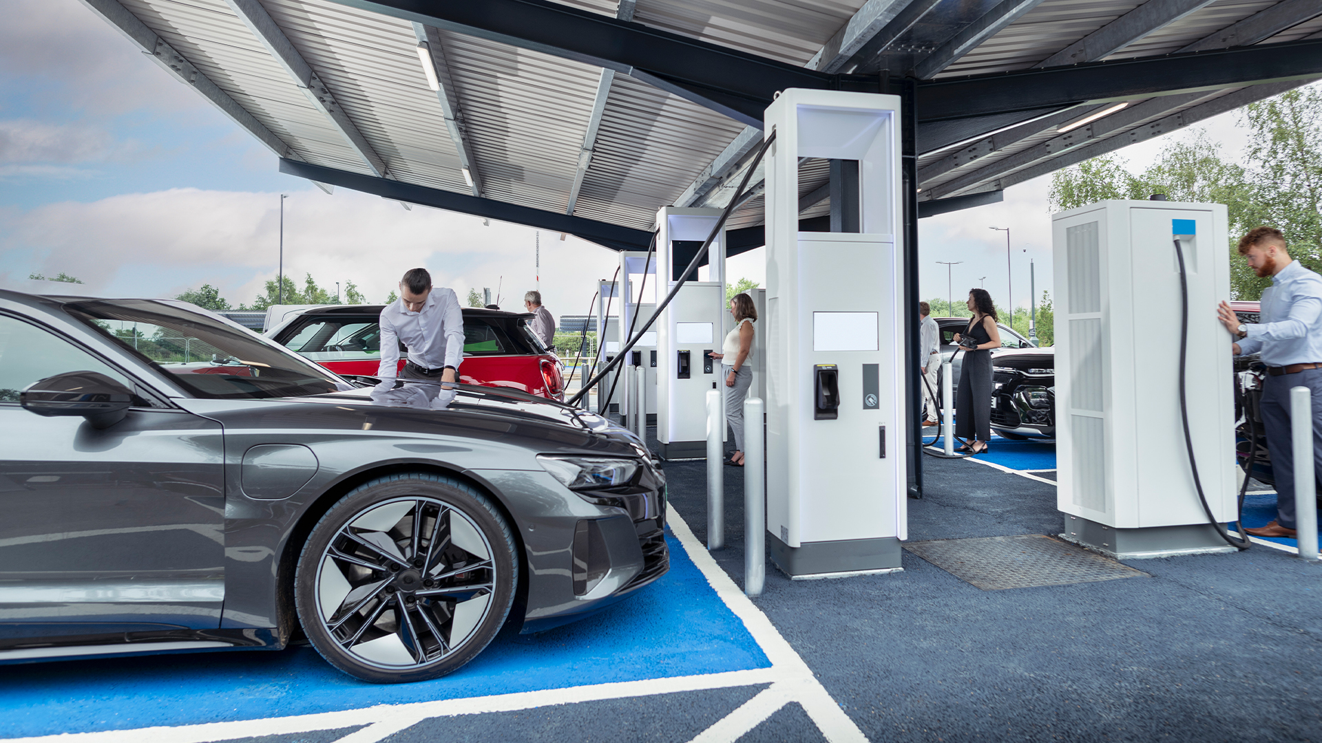 Vehicles charging at an EV charging station