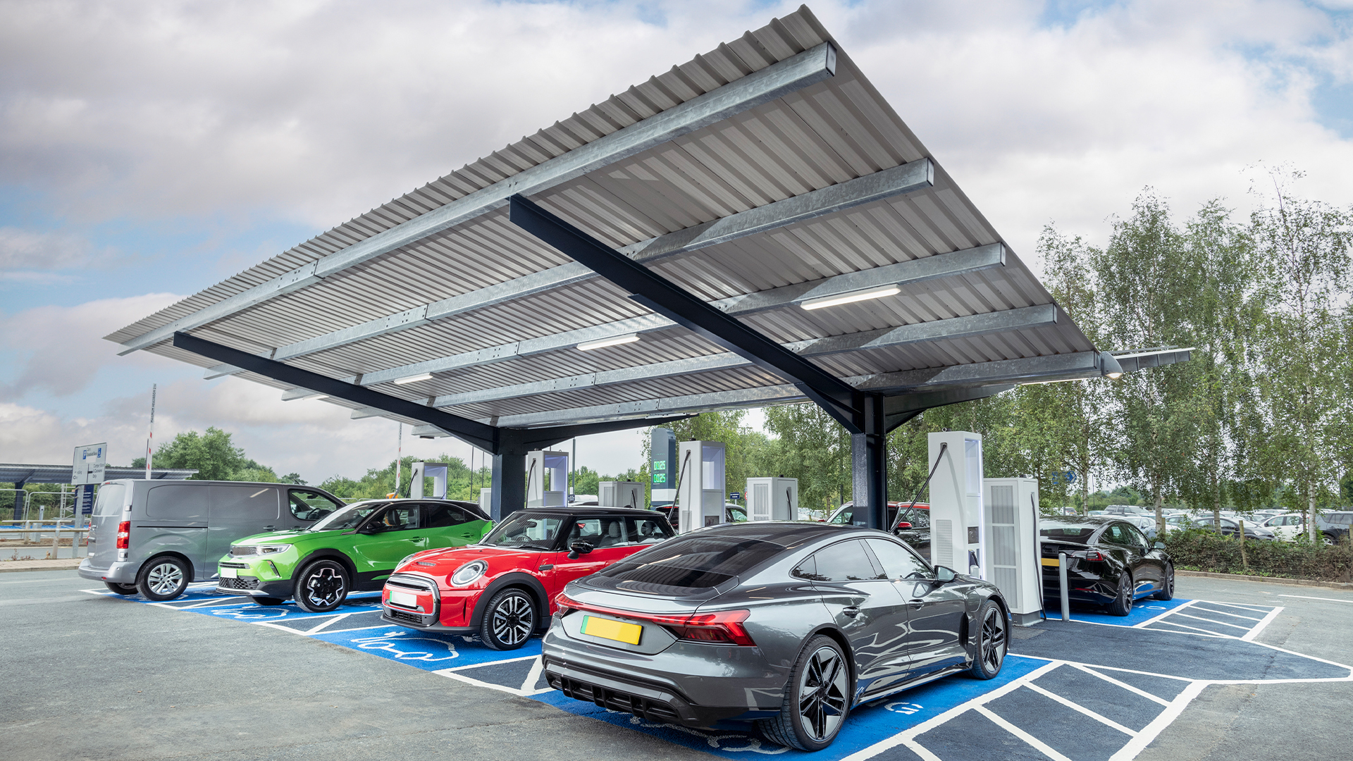 Vehicles charging at an EV charging station