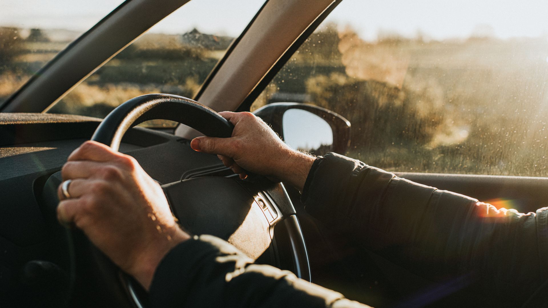 hands on a steering wheel