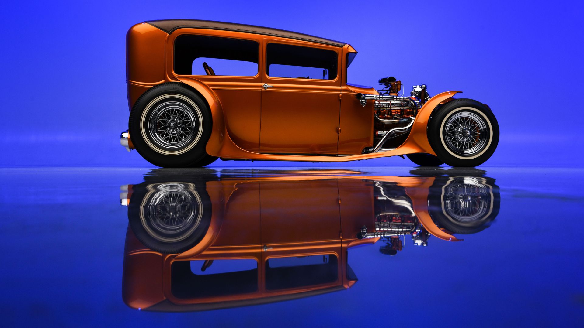 orange hot rod on blue background