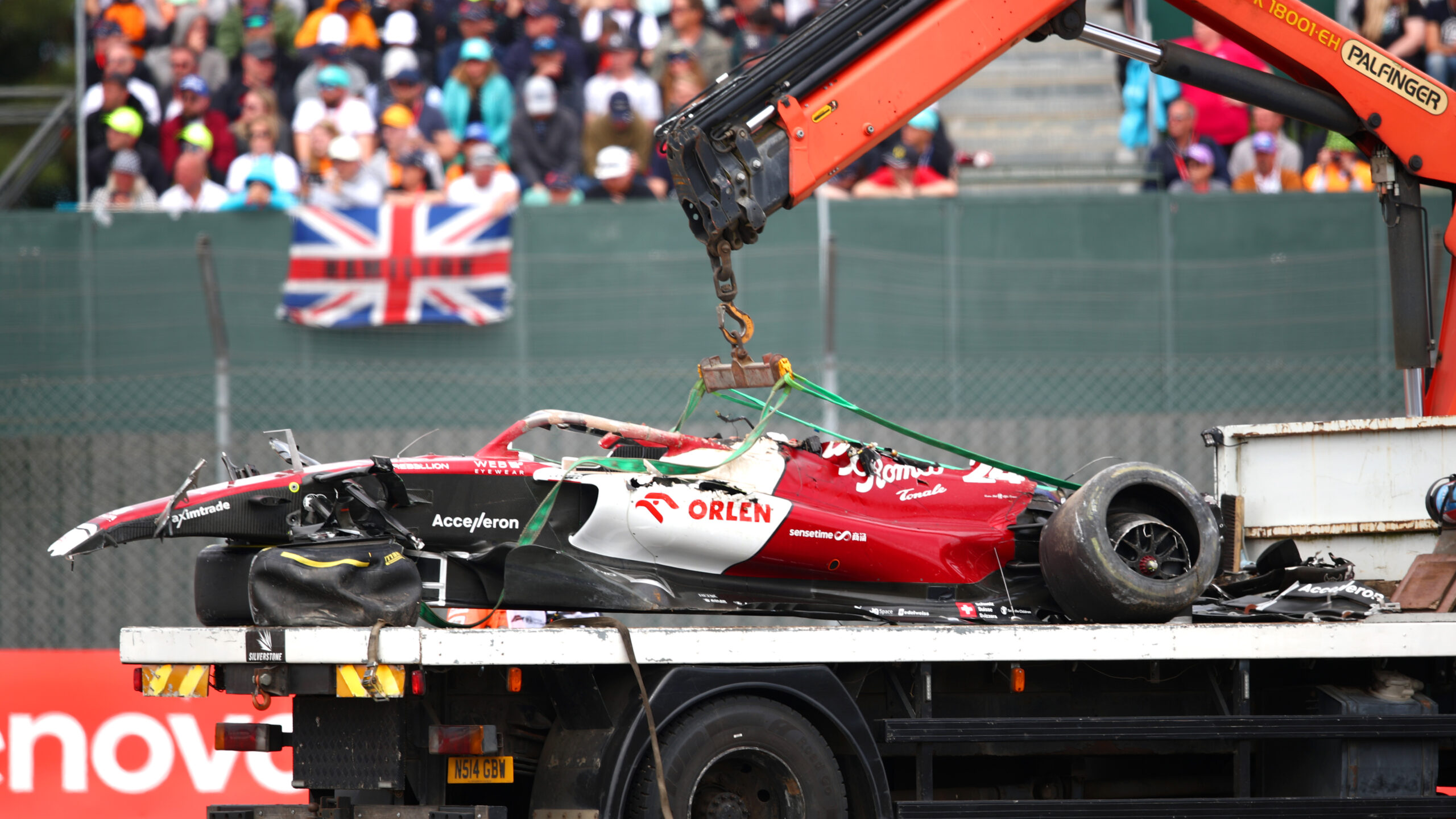 Zhou's car on a flatbed truck, showing how little of the upper car is left following the crash