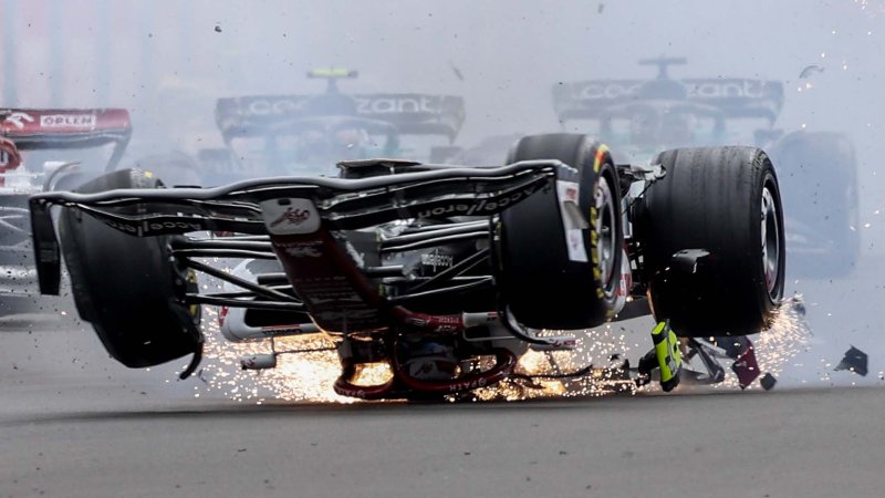 Zhou Guanyu's car skidding, upside down, across the tarmac at Abbey corner, Silverstone