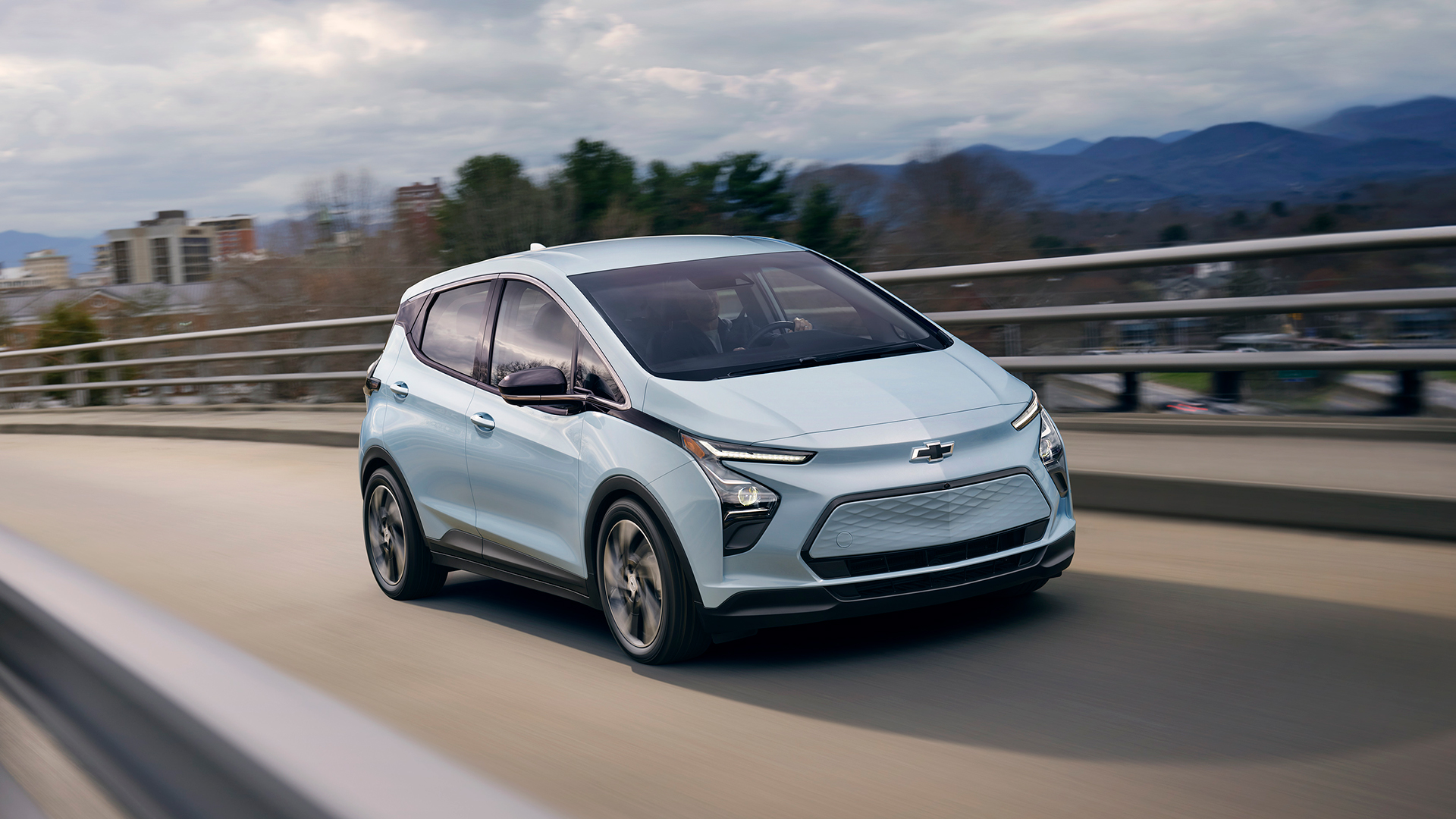 A Chevrolet Bolt EV driving on the highway.