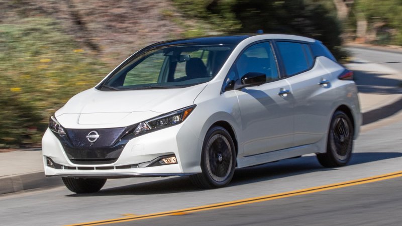 A white Nissan Leaf electric vehicle.