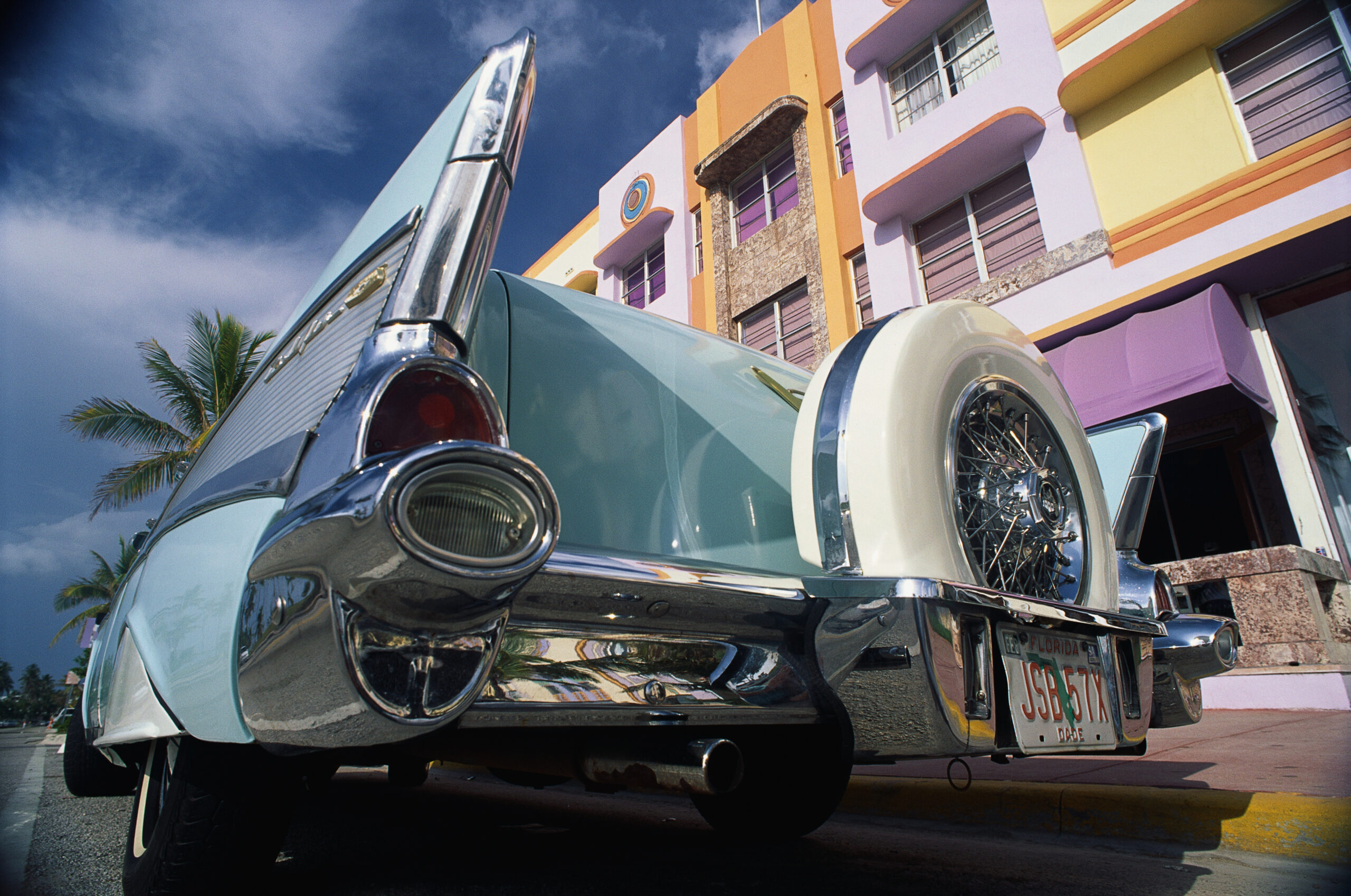 This is the art deco district with a 1957 Chevrolet parked in front of a building, This area is also known as SOBE which stands for South Beach Miami. (Photo by: Joe Sohm/Visions of America/Universal Images Group via Getty Images)