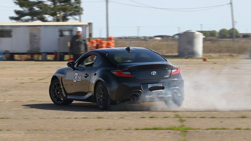 A Toyota GR86 drifting at an autocross event.