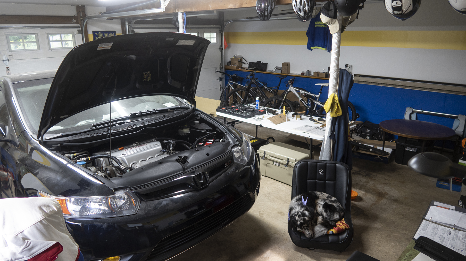 Honda parked in garage.