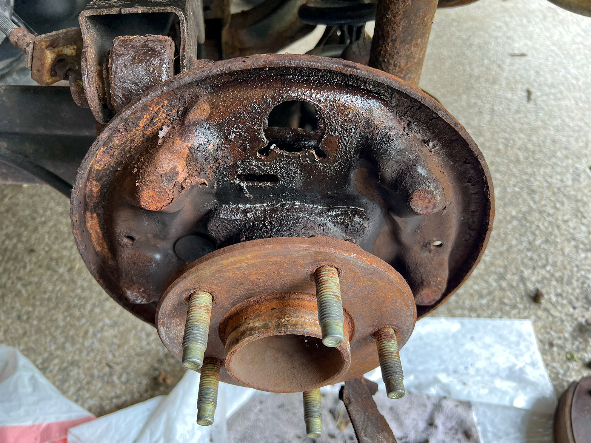 A backing plate on drum brakes.