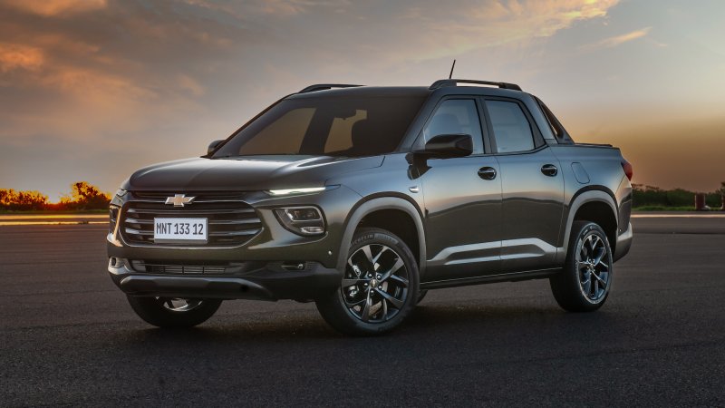 2023 Chevrolet Montana pickup truck in dark green against a sunset backdrop