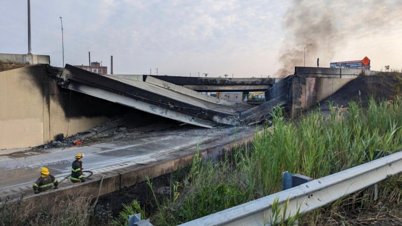 PHILADELPHIA, PA - JUNE 11: In this handout photo provided by the City of Philadelphia Office of Emergency Management, smoke rises from a collapsed section of the I-95 highway on June 11, 2023 in Philadelphia, Pennsylvania. According to reports, a tanker fire underneath the highway caused the road to collapse. (Photo by City of Philadelphia Office of Emergency Management via Getty Images)