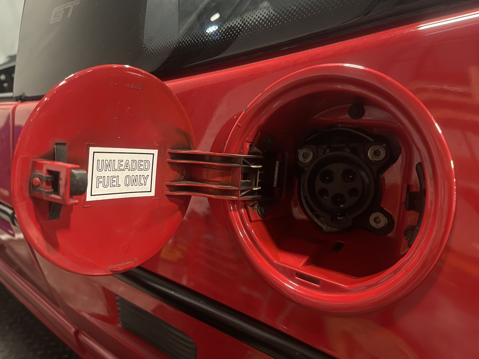 1988 Pontiac Fiero GT EV by Classic EV Conversions. A charge port can be seen inside the gas cap.