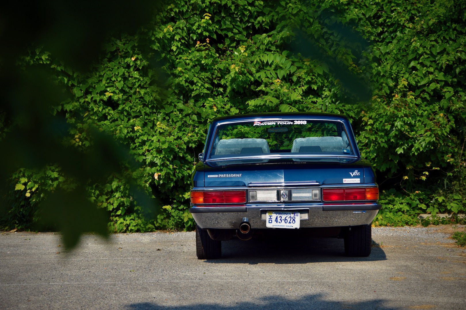 1989 Nissan President rear in a green parking lot