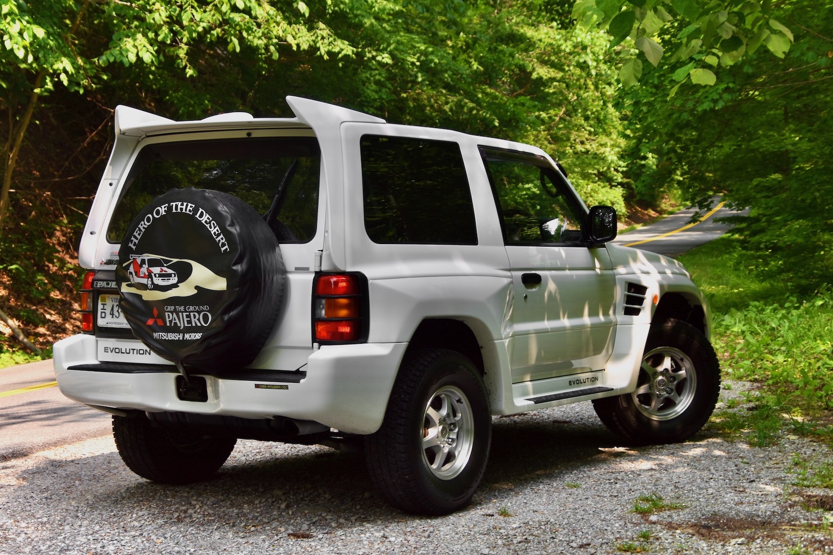 1997 Mitsubishi Pajero Evolution rear three-quarter by the side of the road in a woodsy area