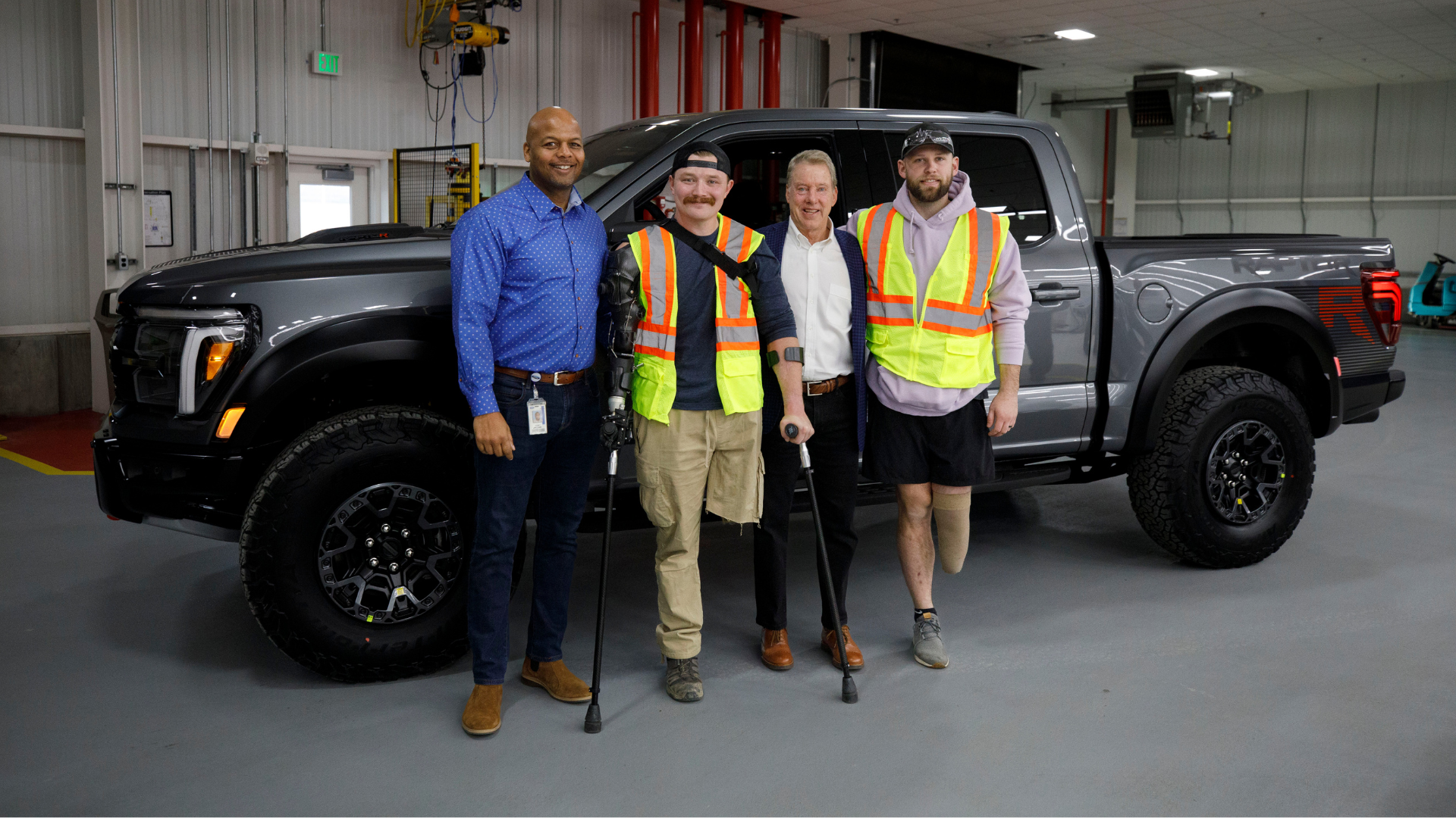 4 men next to a truck