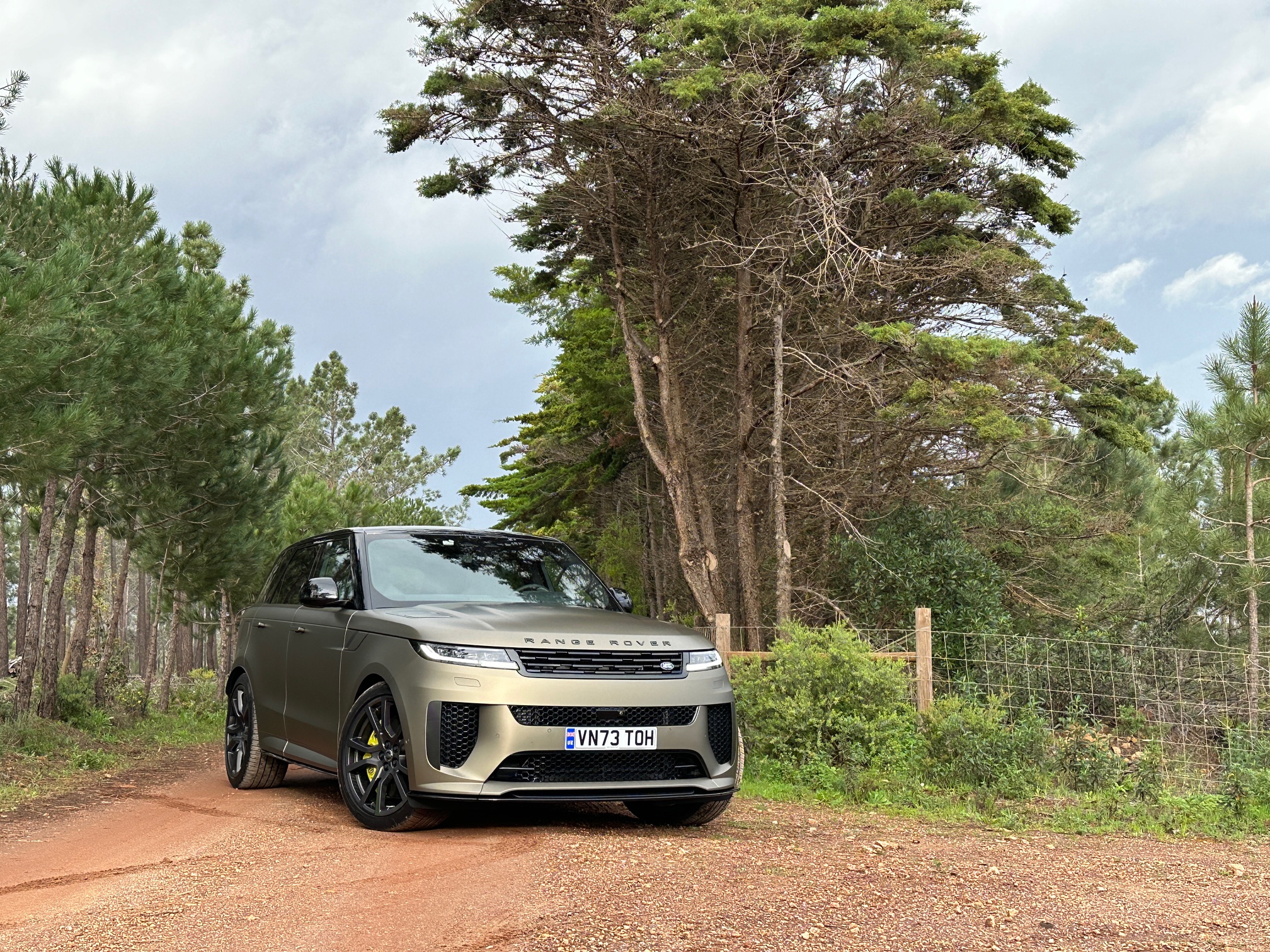 tan SUV on a dirt road