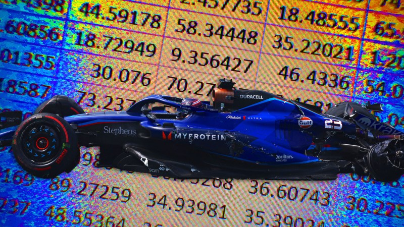 A crashed Williams Formula 1 car in front of a backdrop of a Microsoft Excel spreadsheet