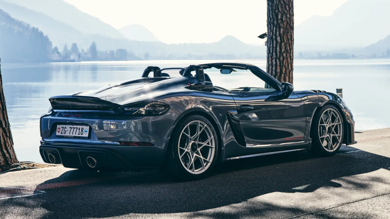 Rear three-quarter view of a gray Porsche 718 Boxster.