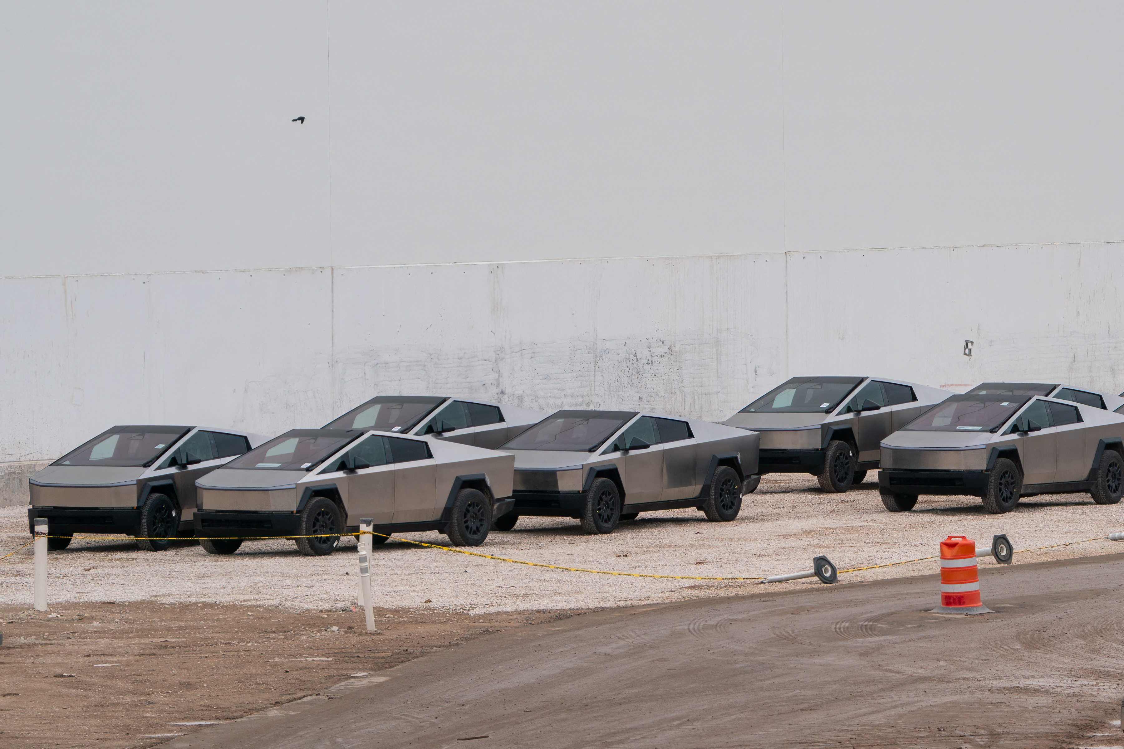 Newly manufactured Tesla Cybertrucks are parked outside the company's Giga Texas factory on December 13, 2023, in Austin, Texas. Tesla began customer deliveries of the Cybertruck on November 30, 2023, bringing to fruition an Elon Musk passion project that the billionaire boasts is stronger than bullets and faster than a Porsche. (Photo by SUZANNE CORDEIRO / AFP) (Photo by SUZANNE CORDEIRO/AFP via Getty Images)