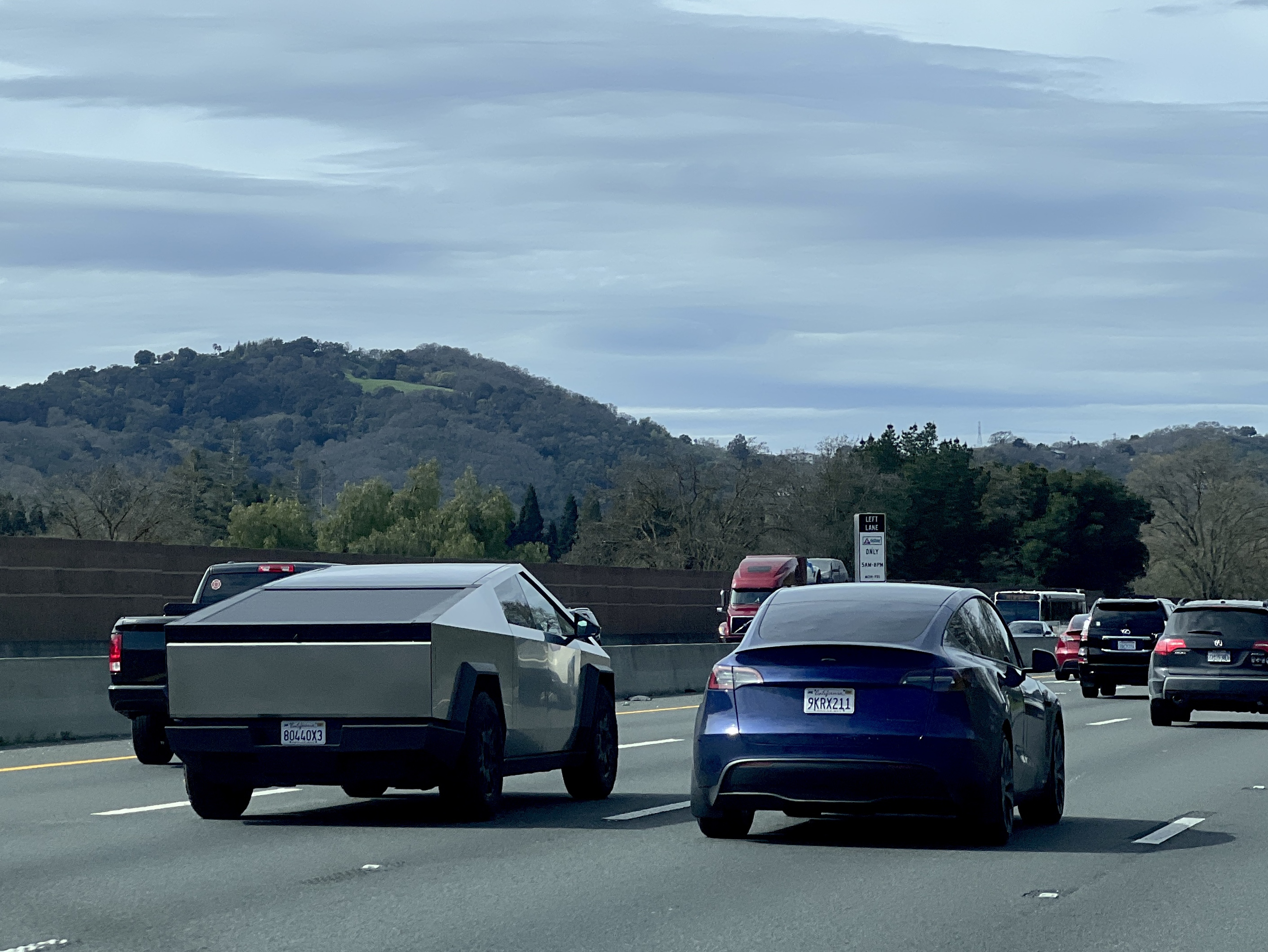 A Tesla Cybertruck is seen driving beside a Tesla sedan on the 680 Freeway in the San Francisco Bay Area, Danville, California, March 10, 2024. (Photo by Smith Collection/Gado/Getty Images)