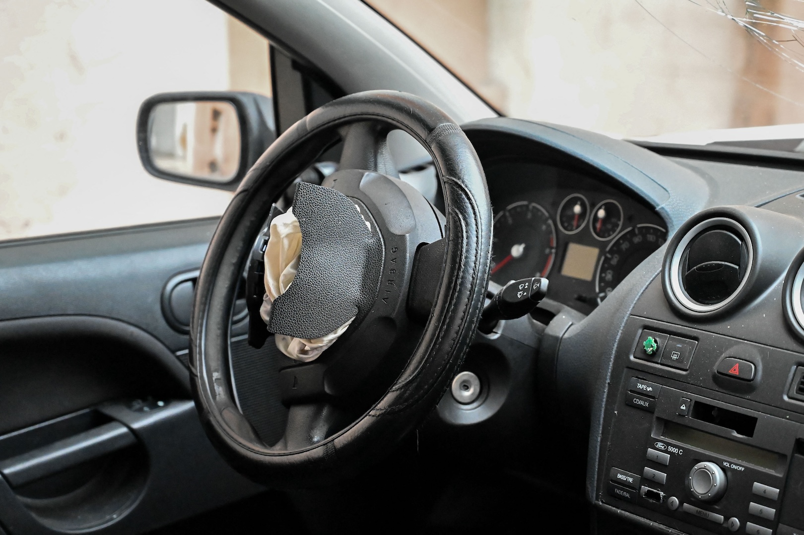 A car s steering wheel airbag is triggered on a street in Villeurbanne, France, on April 24, 2024.