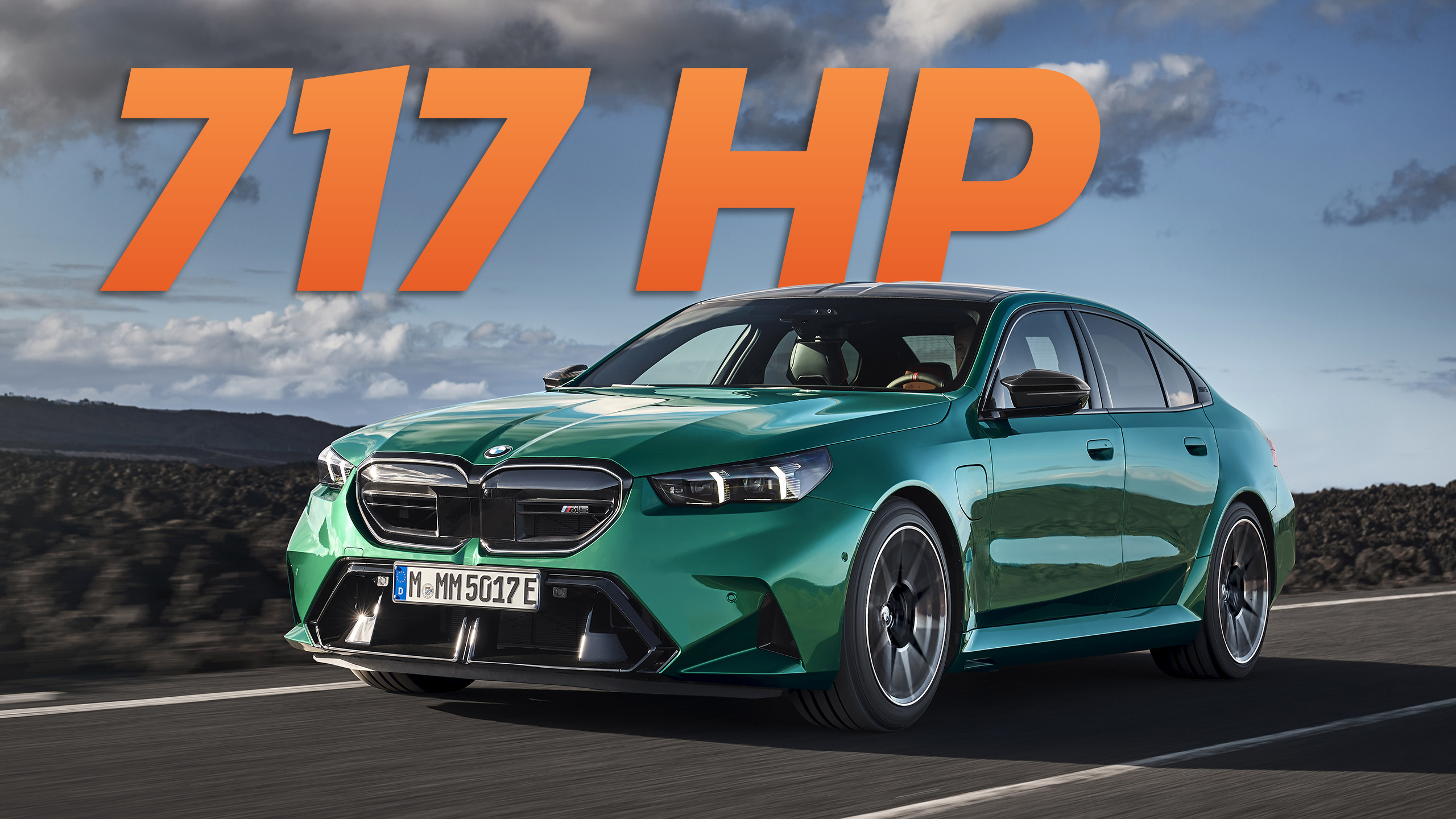 Image of 2025 M5 on road with "717 HP" written behind it in large text.