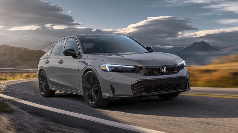 2025 Honda Civic Si in gray cornering.