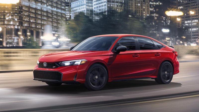 2025 Honda Civic Si in red, seen from front third-quarter.