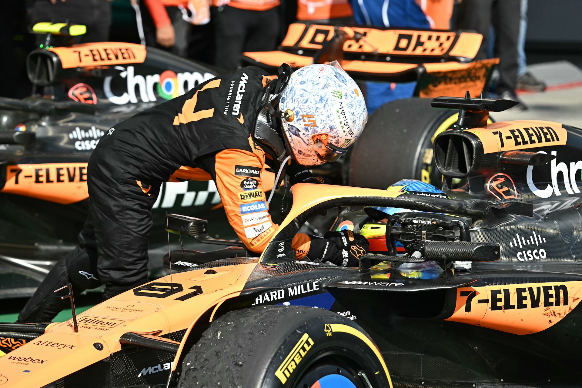 Team McLaren-Mercedes' Lando Norris congratulates Team McLaren-Mercedes' Oscar Piastri after Piastri won the Formula One Hungarian Grand Prix at the Hungaroring race track in Mogyorod near Budapest on July 21, 2024. (Photo by Attila KISBENEDEK / AFP)