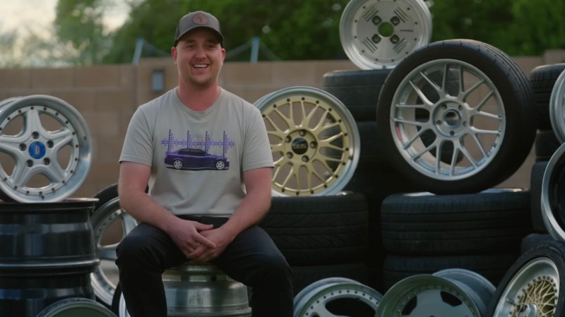 Alex Stearling poses with his wheel collection.