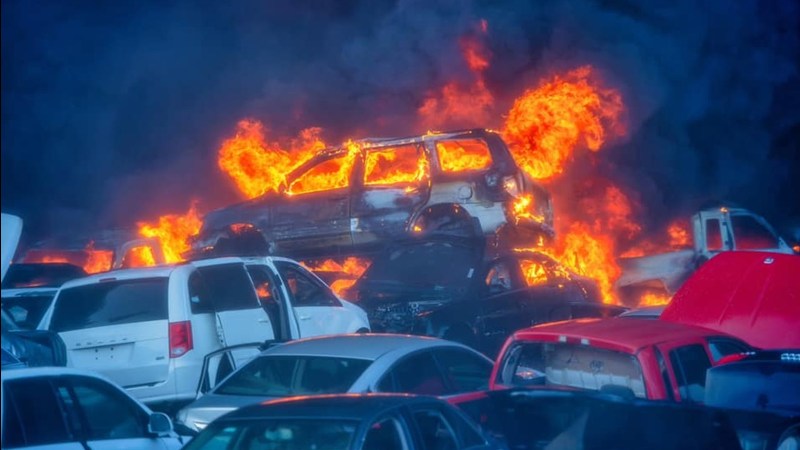Image of the remains of a car on fire at the salvage yard in California where a fire broke out Thursday.