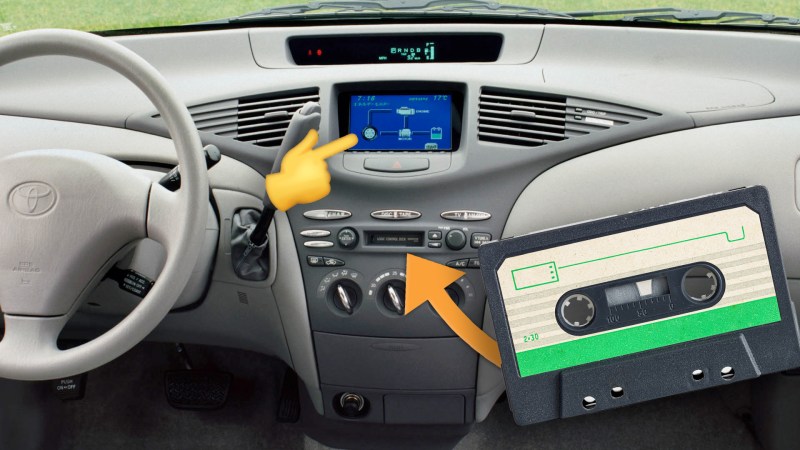 A 2001 Toyota Prius's dashboard, with a touchscreen and a cassette tape player