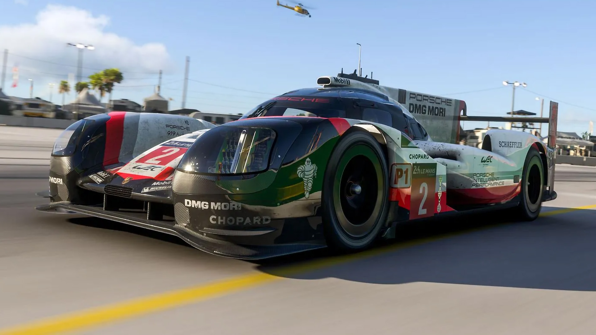 Porsche 919 race car in Forza Motorsport reflecting a nearby billboard.