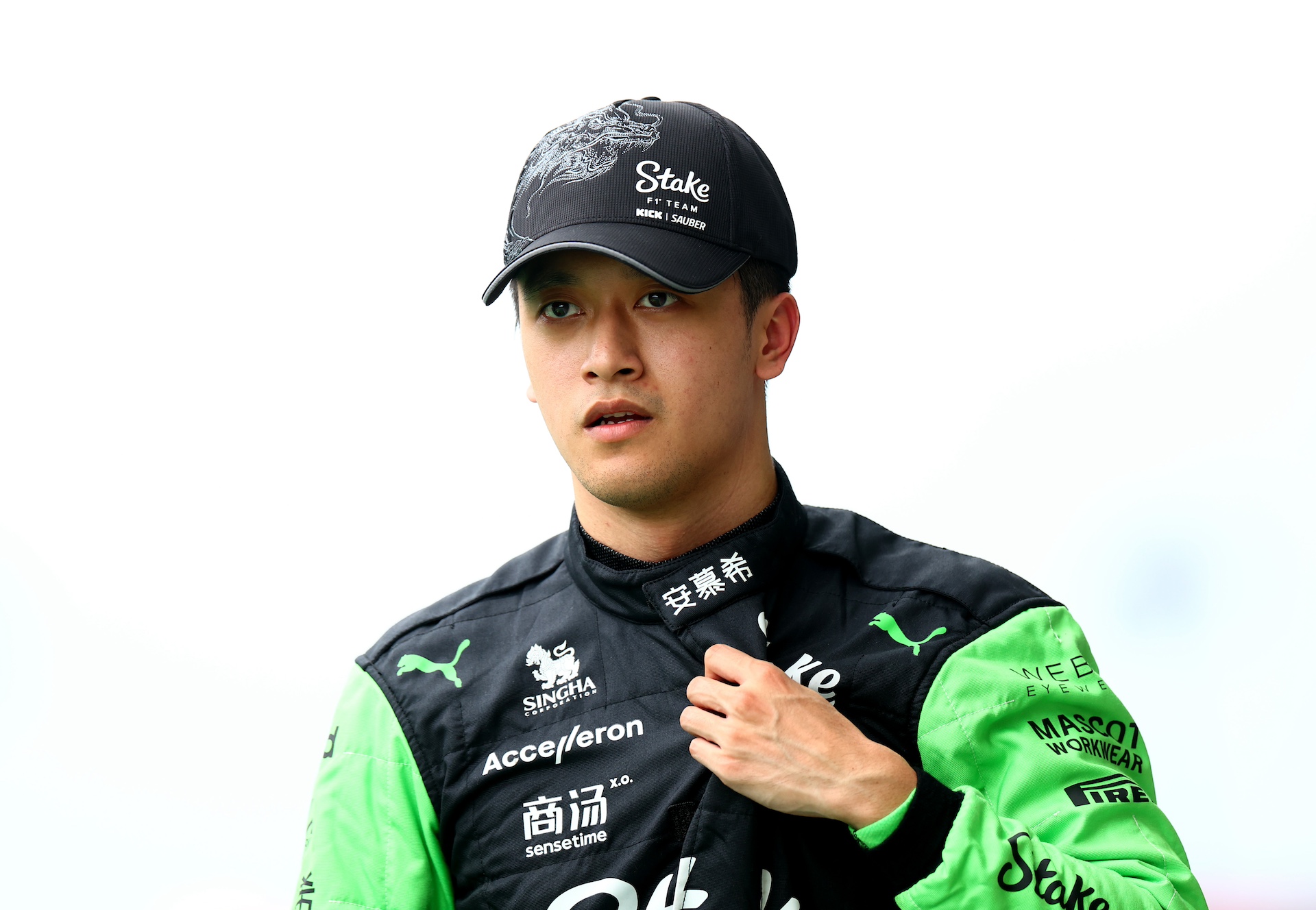 BUDAPEST, HUNGARY - JULY 20: 18th placed qualifier Zhou Guanyu of China and Stake F1 Team Kick Sauber walks in the Pitlane during qualifying ahead of the F1 Grand Prix of Hungary at Hungaroring on July 20, 2024 in Budapest, Hungary. (Photo by Bryn Lennon - Formula 1/Formula 1 via Getty Images)