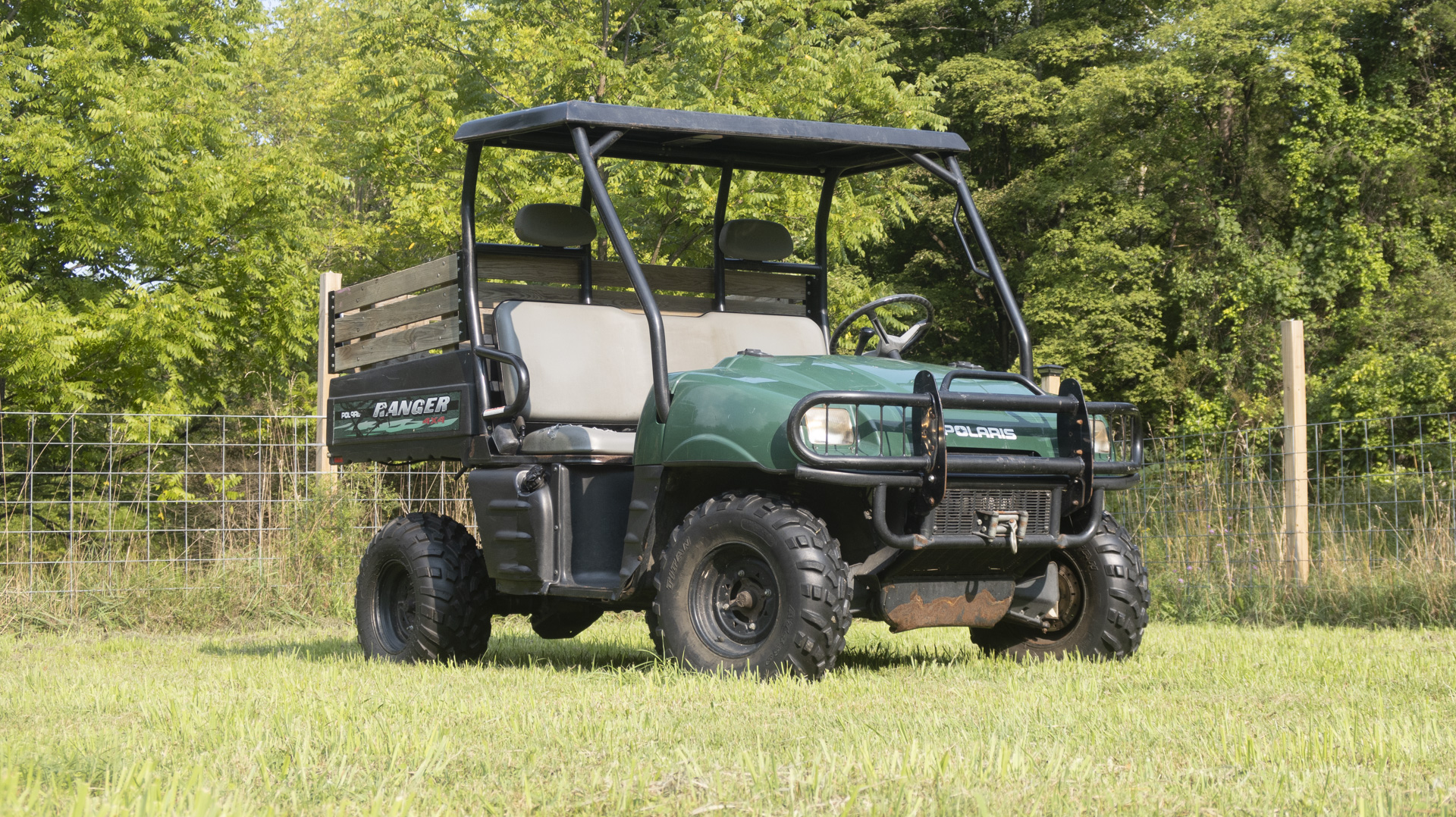 2002 Polaris Ranger parked in a field.