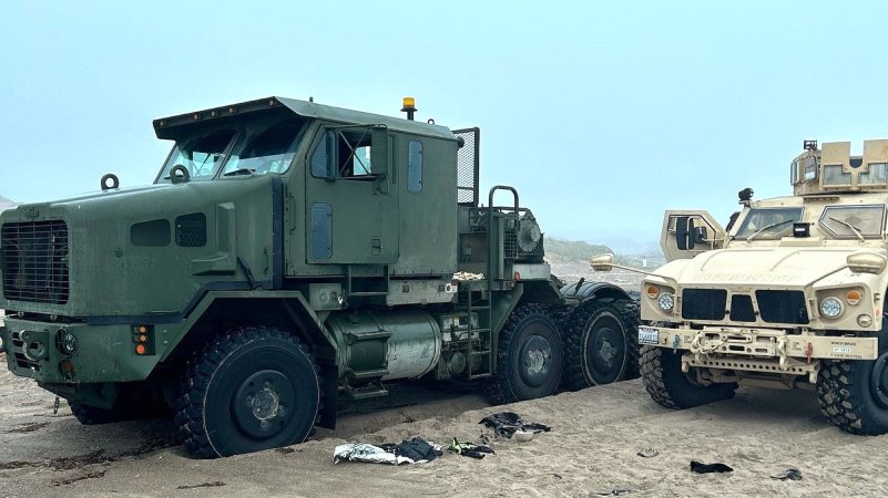 Man Steals Oshkosh M1070 Tank Transporter, Immediately Gets Stuck on Beach