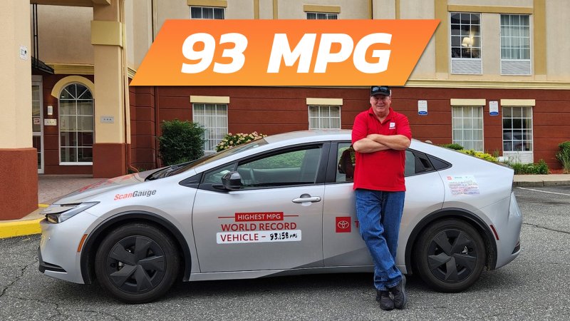 World-recording holding Prius for highest mpg across America.