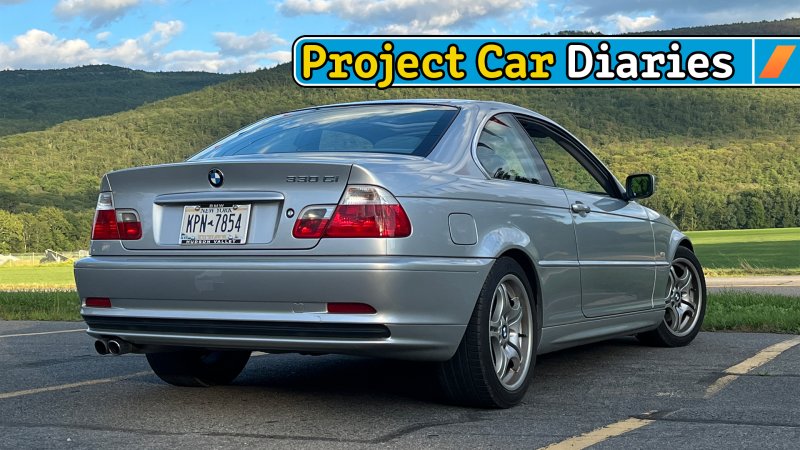 BMW E46 coupe from the lower rear three-quarter.